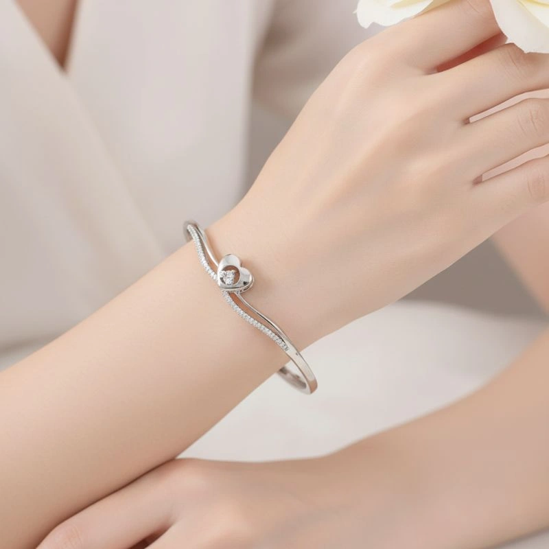 Silver bracelet on a model's wrist for a jewellery catalog photoshoot Silver bracelet on a model's wrist for a jewellery catalog photoshoot